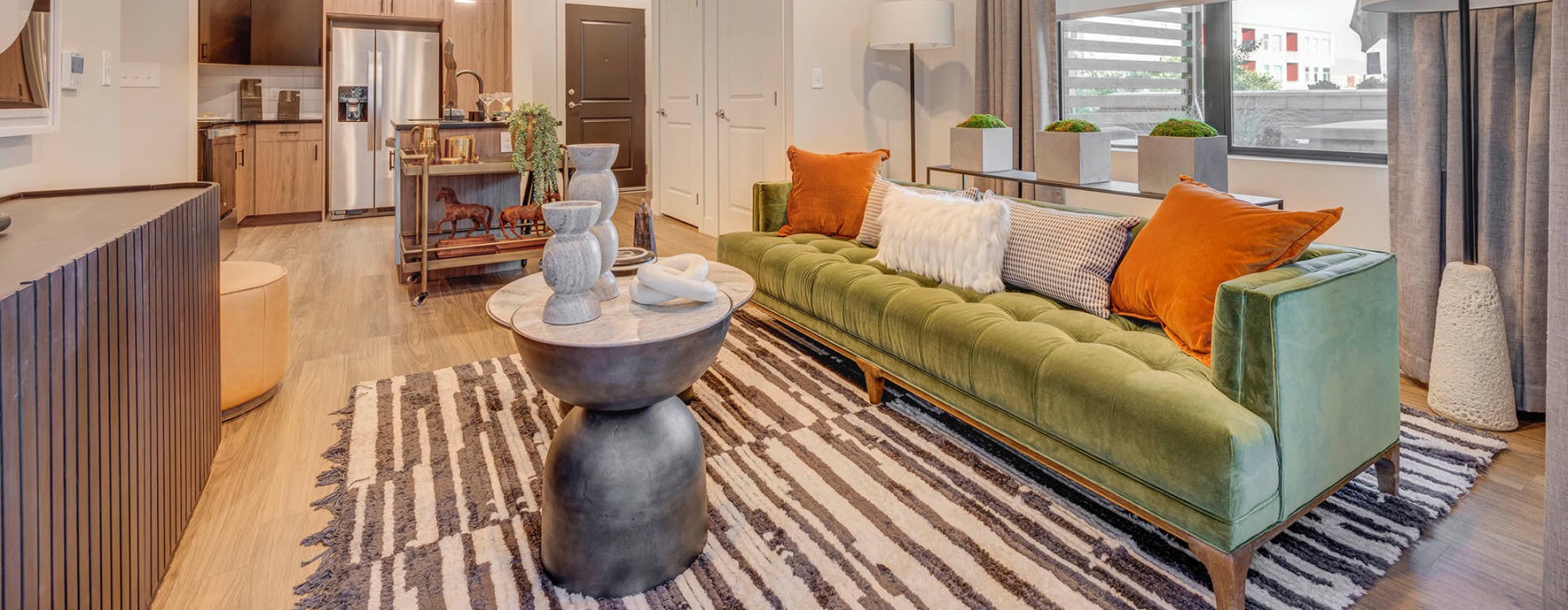 a living room with a green couch