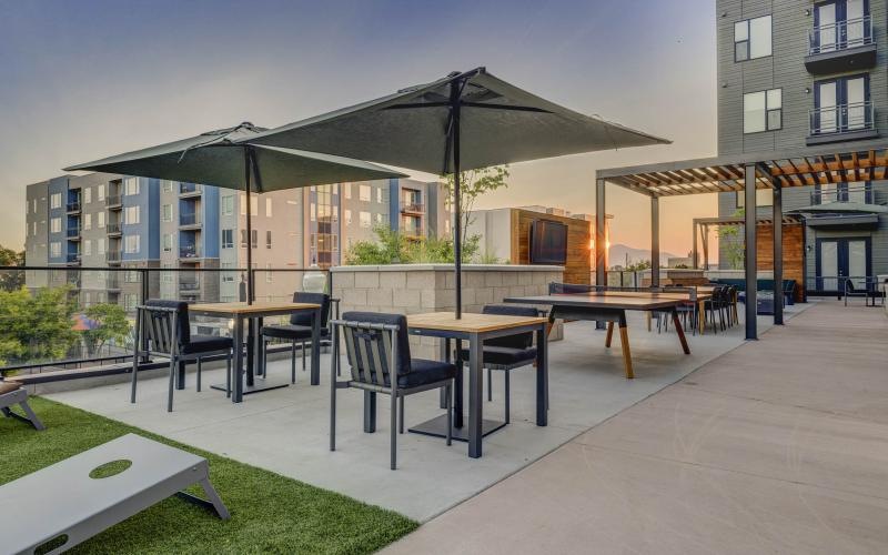 a patio with tables and chairs