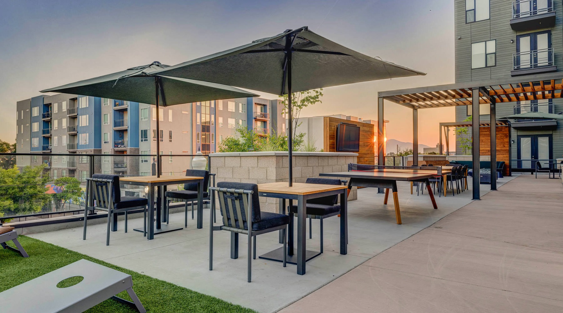 a patio with tables and chairs
